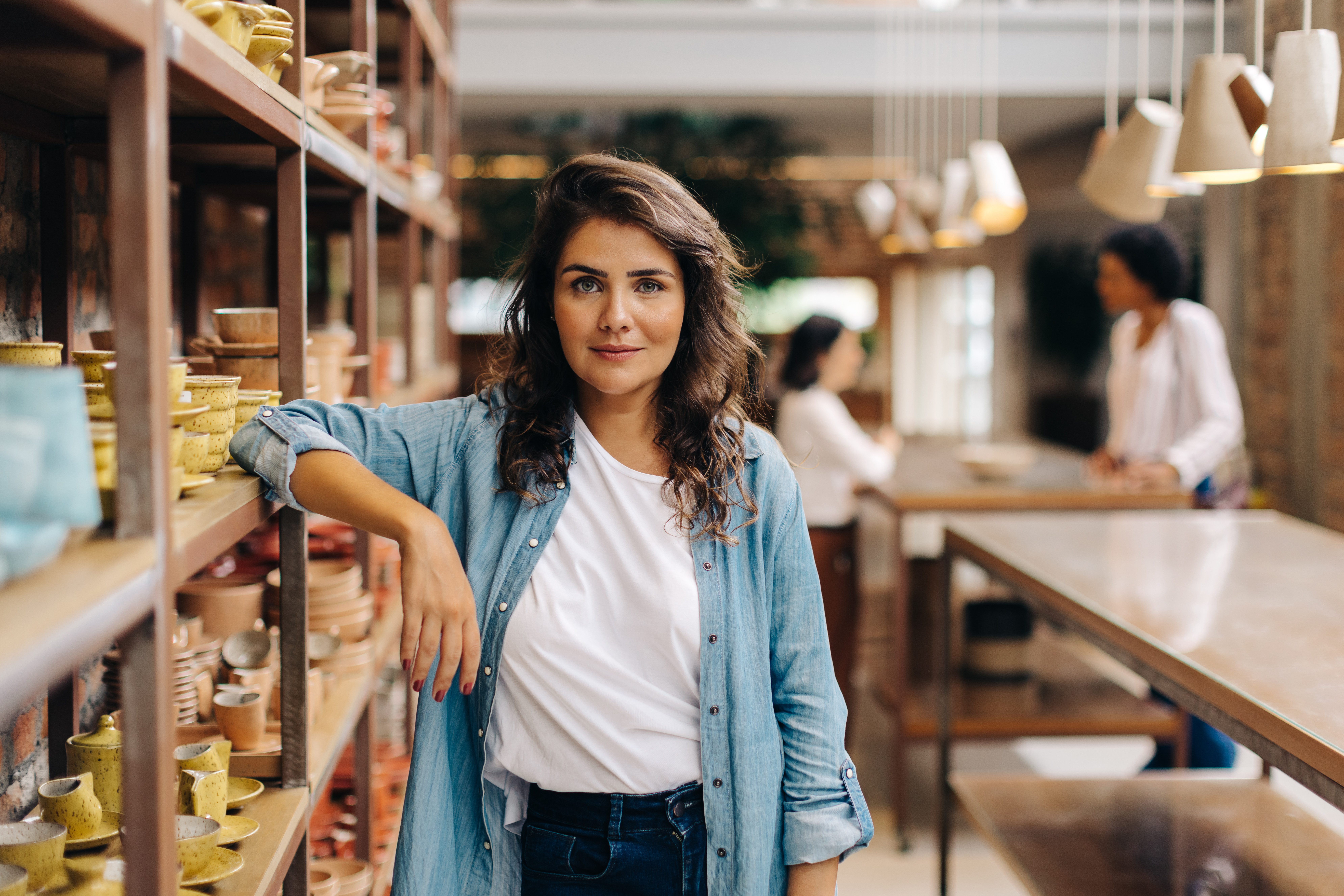 Best Practices for Finding Diverse Suppliers Confident young woman looking at the camera in her ceramic store. Female ceramist managing a store with handmade earthenware products. Creative young businesswoman running a small business.