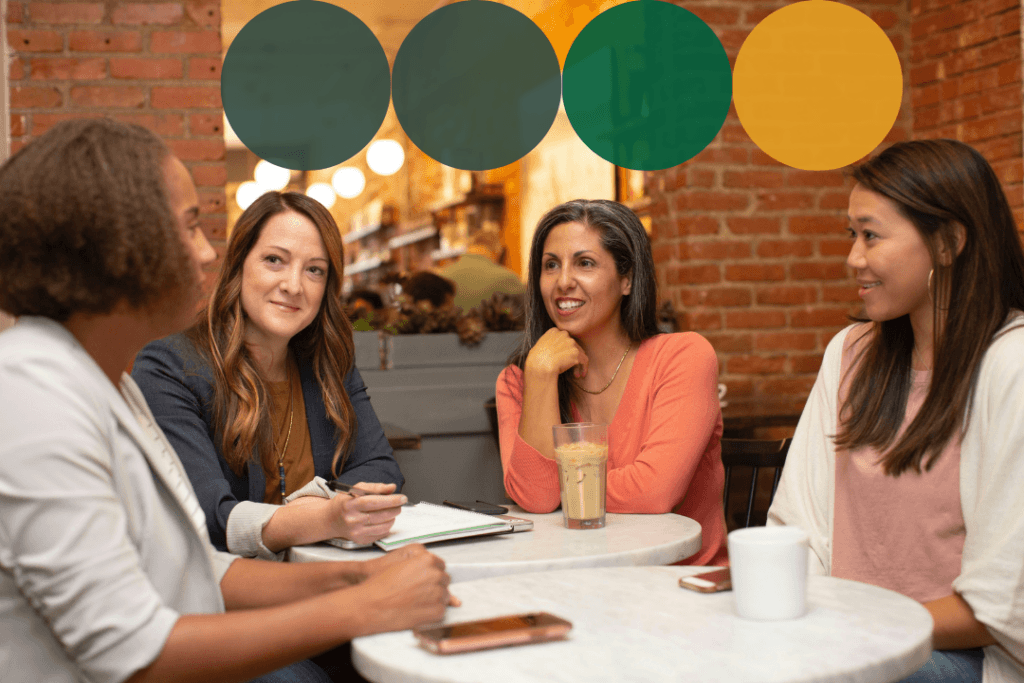 Four women engaged in a collaborative discussion around a table in a warm, casual setting, with dark teal, green, and golden yellow branded circle graphics overlaid along the top of the image.